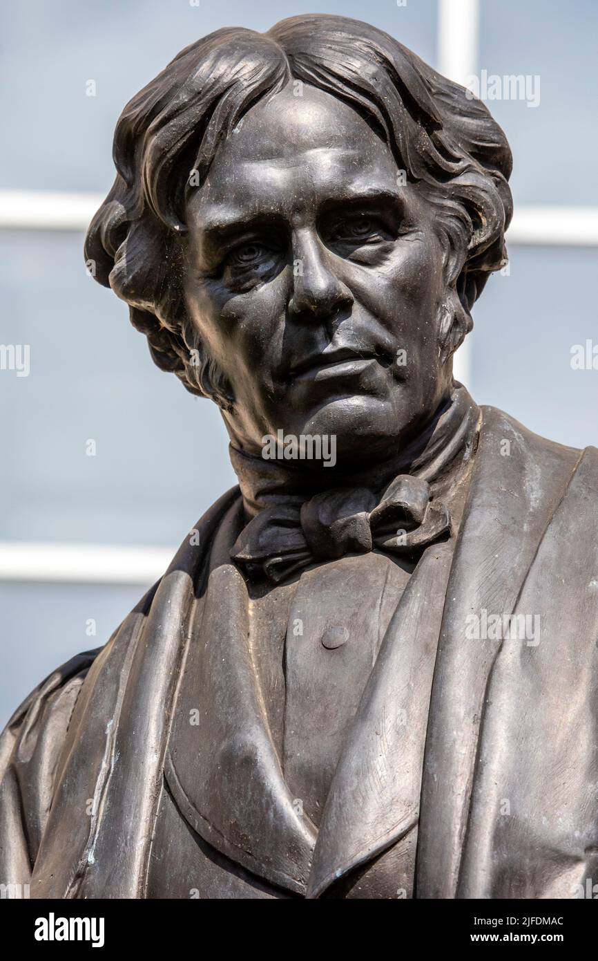 London, UK - April 20th 2022: A statue of famous English scientist Michael Faraday, located on Savoy Place in central London, UK. Stock Photo