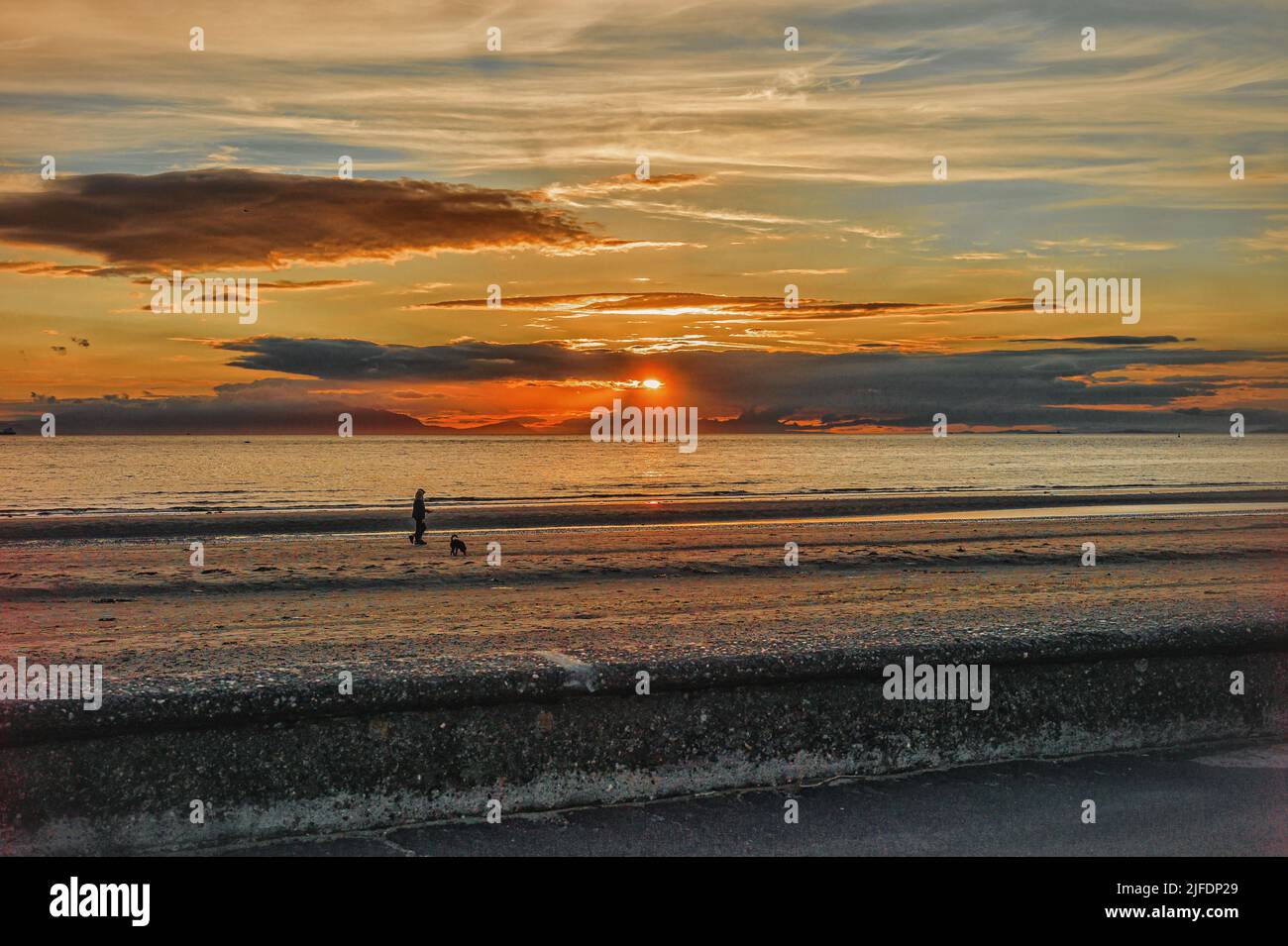 Summer sunset over the Island of Arran from Ayr beach Stock Photo Alamy