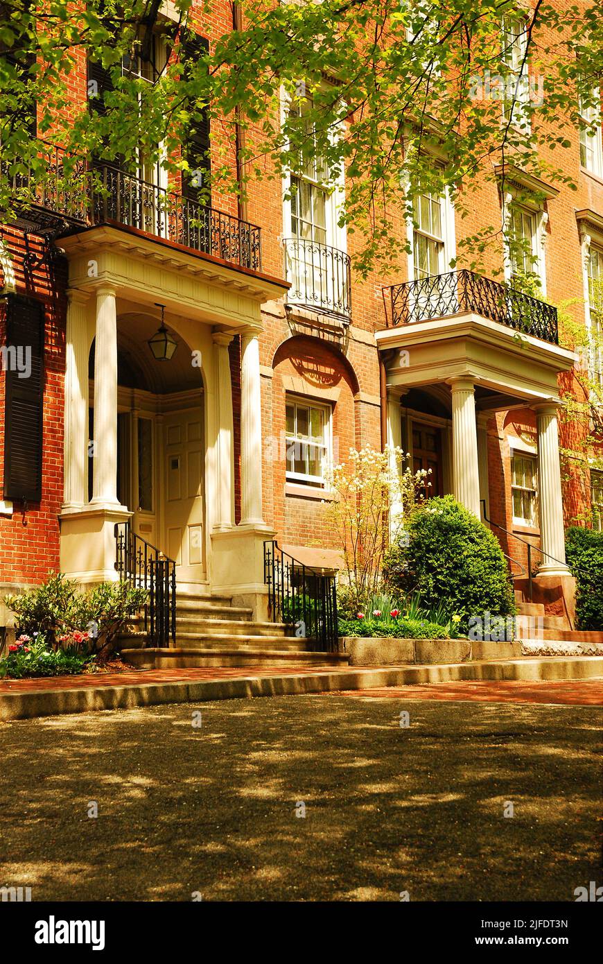 Luxury row homes line the street of the Beacon Hill neighborhood of Boston are a fine example of the Federal style architecture in historic cities Stock Photo