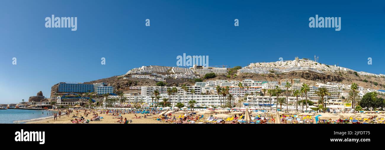 2 February 2022-Panoramic photo of beautiful beach of Playa de Amadores near Puerto Rico town, Gran Canaria, Canary Islands. Spain Stock Photo