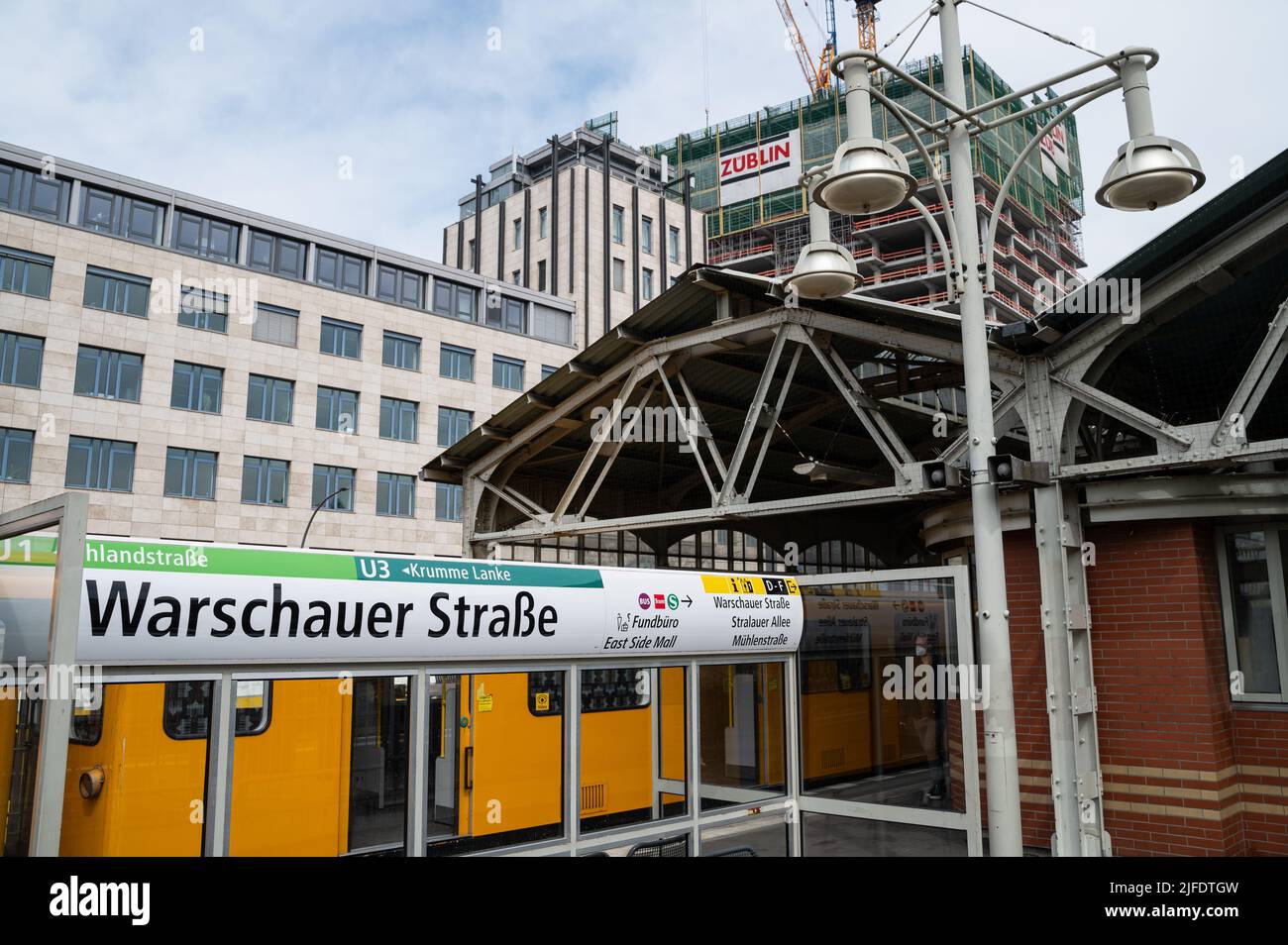 30.04.2022, Berlin, Germany, Europe - Metropolitan railway (U-Bahn) waits at platform of Warschauer Strasse station in the locality of Friedrichshain. Stock Photo