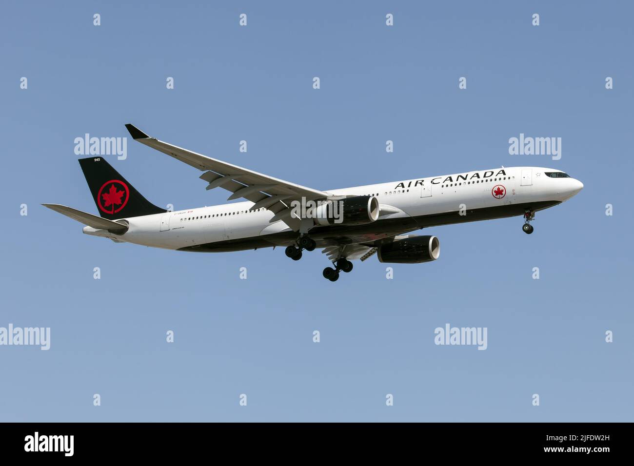 An Air Canada Airbus 330-300 landing at Montreal Pierre Elliott Trudeau Int'l Airport. Air Canada is the flag carrier and the largest airline of Canada by fleet size and passengers carried. Air Canada maintains its headquarters in Montreal, Quebec. Stock Photo