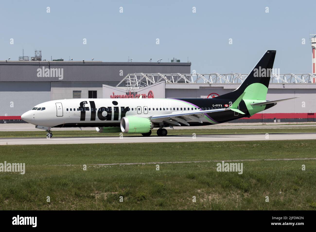 A Flair Airlines Boeing 737-8 MAX just landed at Montreal Pierre Elliott Trudeau Int'l Airport. Flair Airlines is a Canadian low-cost airline headquartered in Edmonton, Alberta, with its main operating base at Edmonton International Airport. Stock Photo