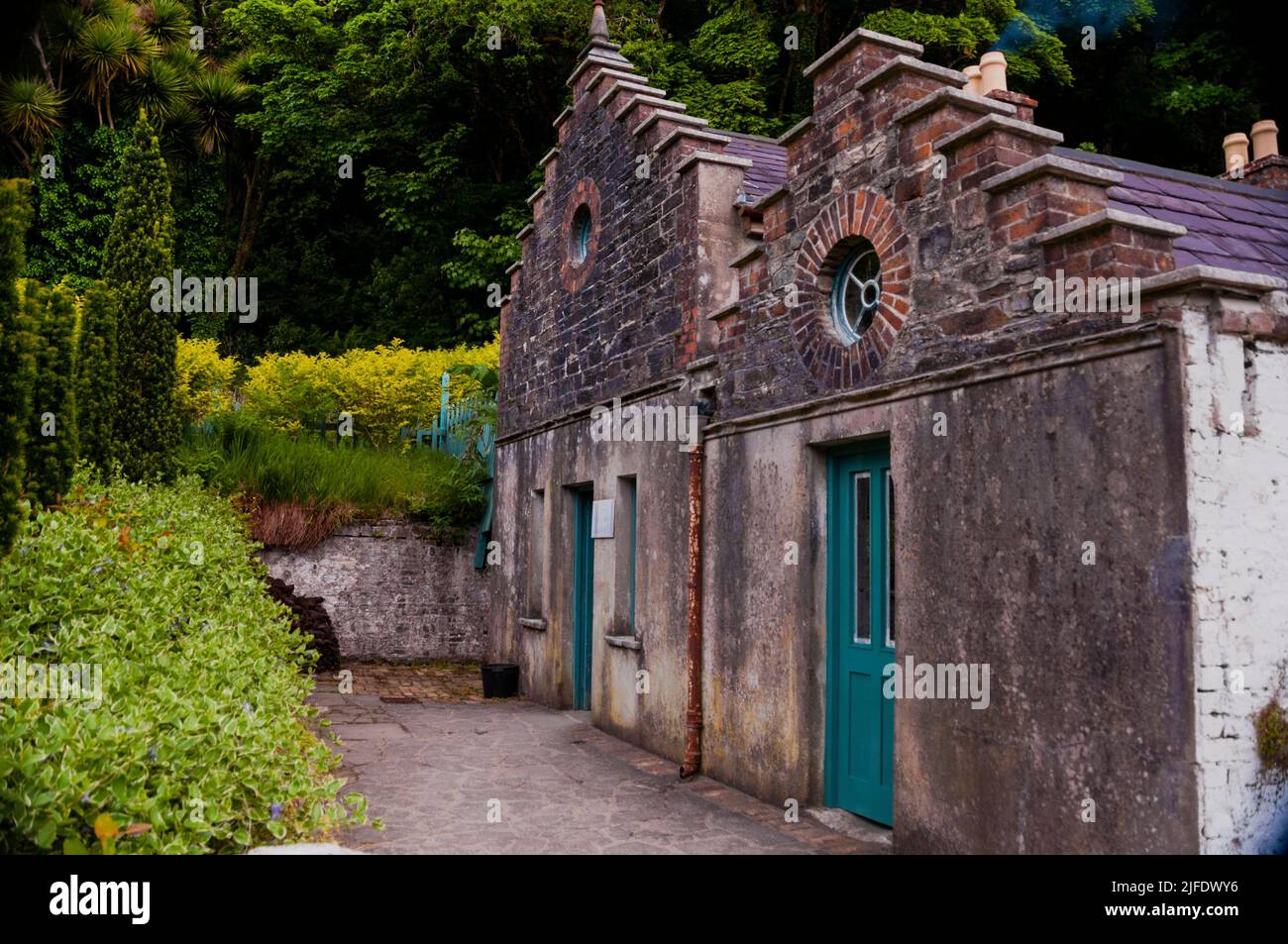 Corbie or crow stepped gable and oculus windows of the Garden Bothy at Kylemore Abbey and Victorian Gardens in Connemara, Ireland. Stock Photo