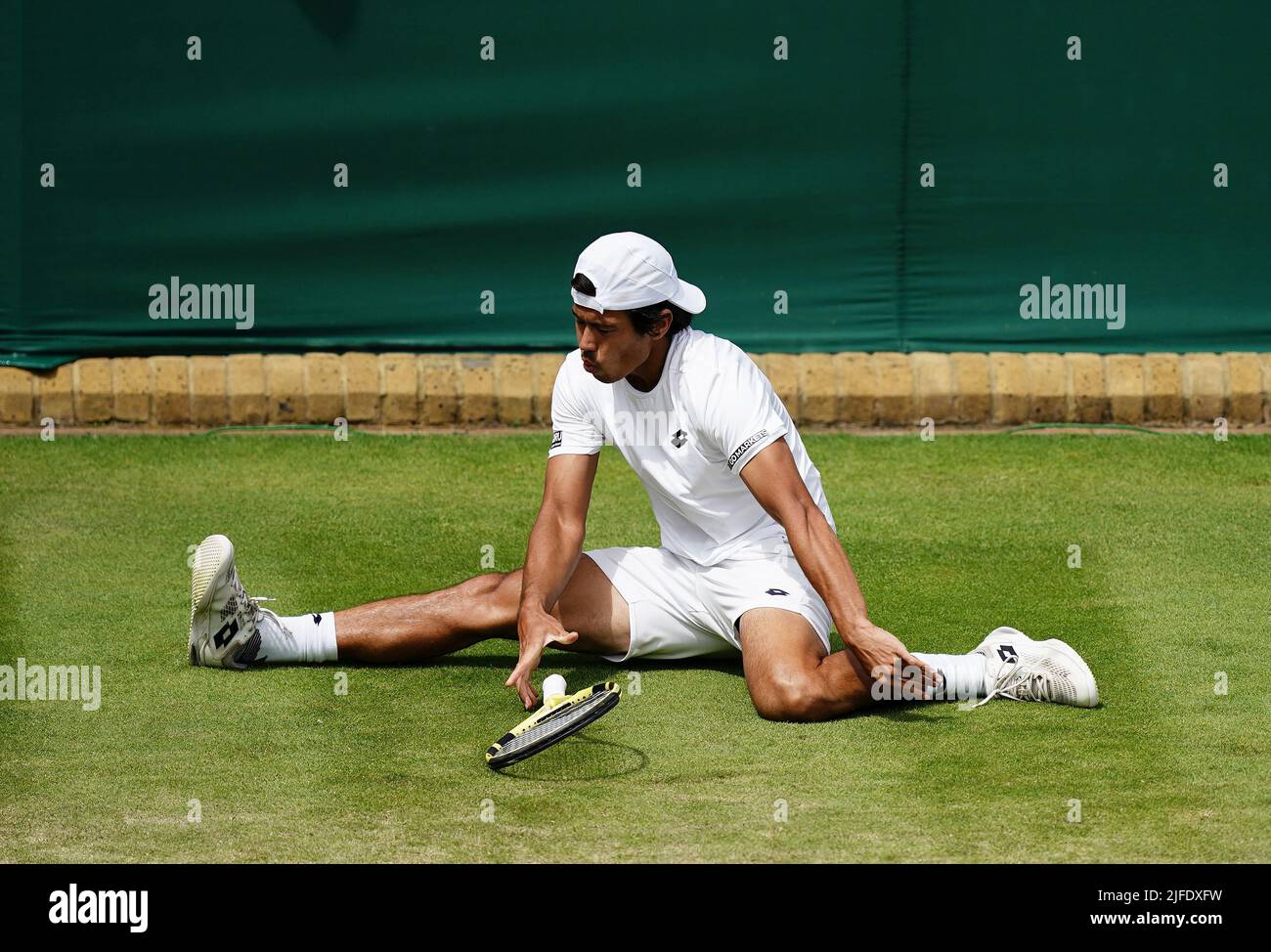 Jason Kubler slips over in his match against Jack Sock during day six
