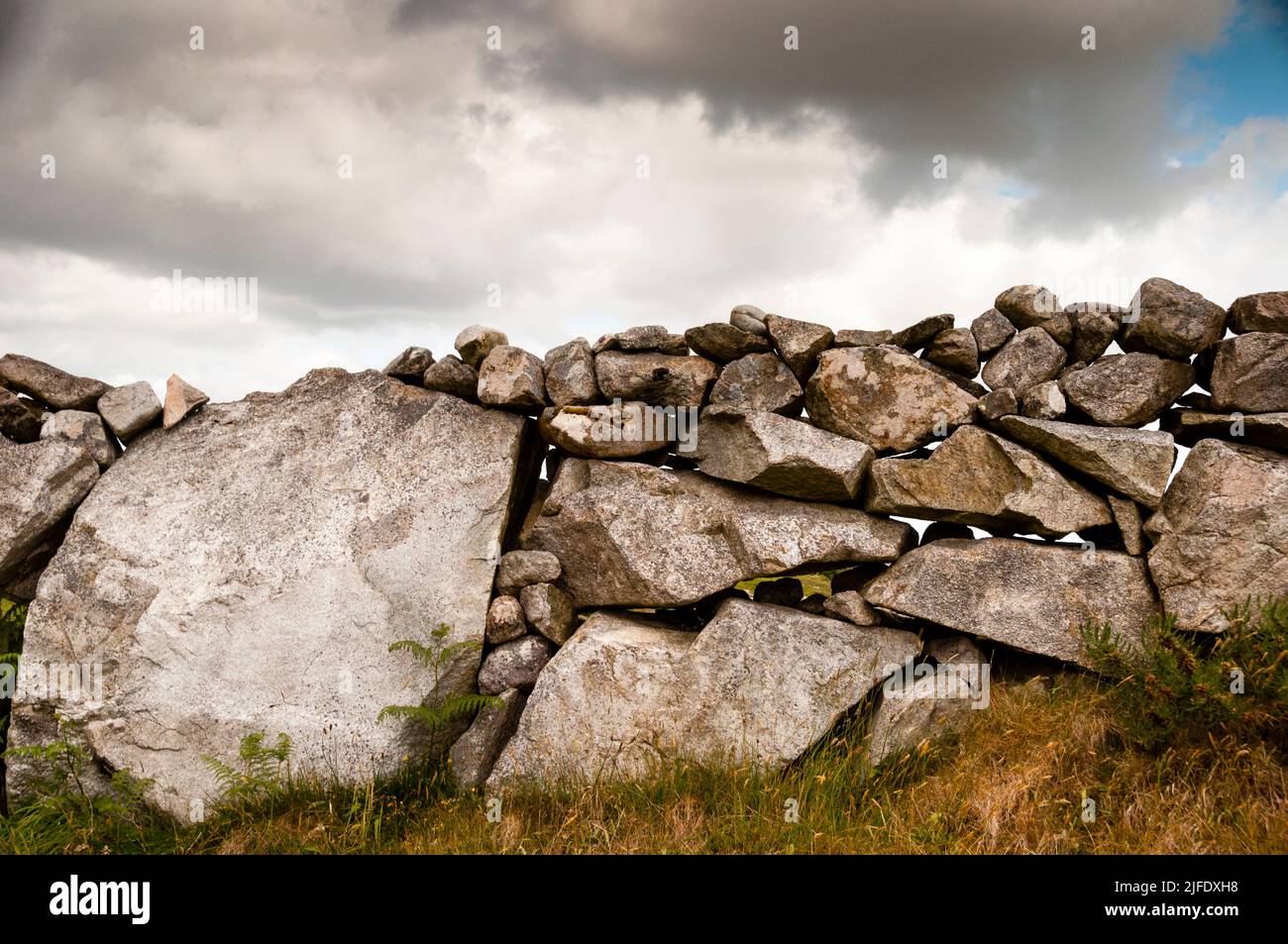 Dry stack stone walls are part of the history and culture, Salthill, Ireland. Stock Photo
