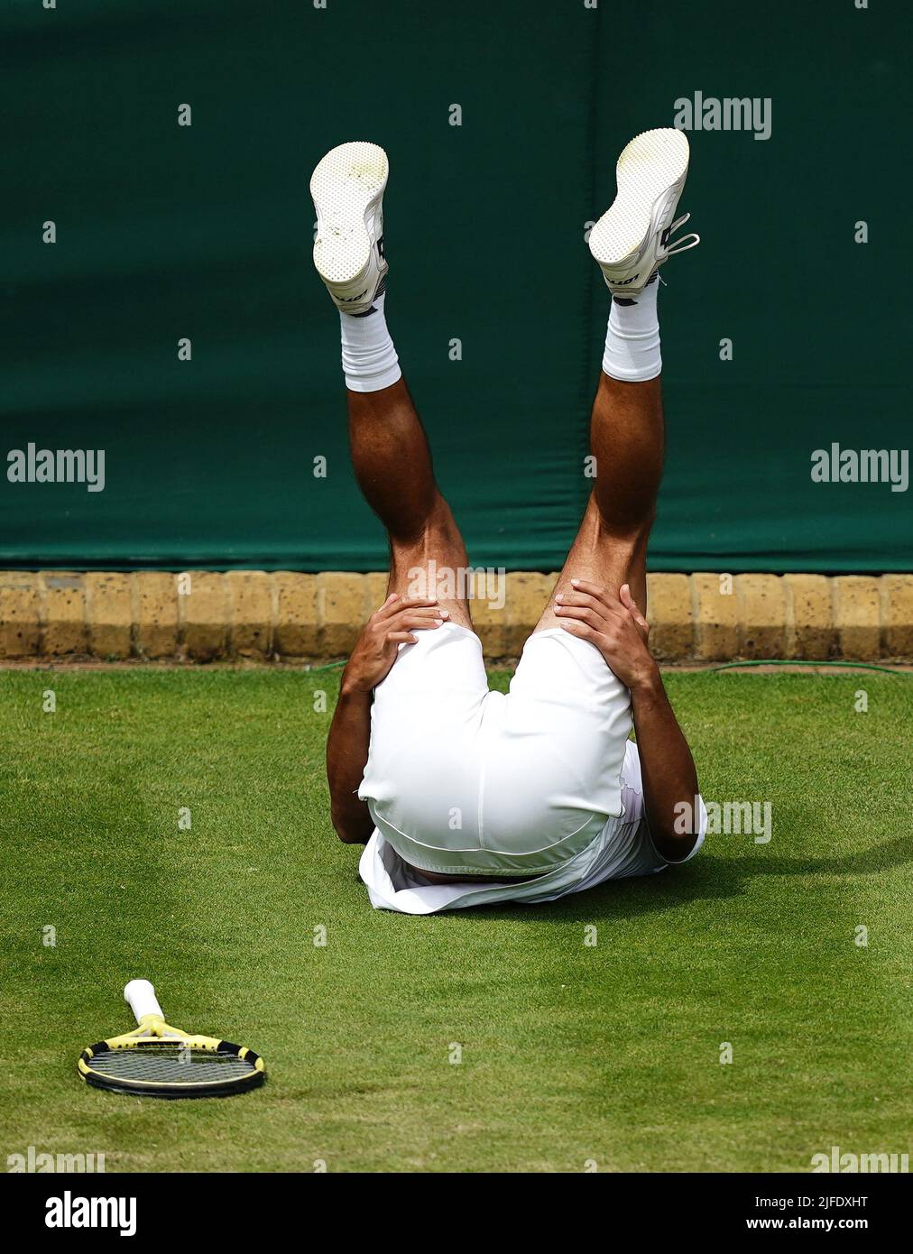 Jason Kubler slips over in his match against Jack Sock during day six