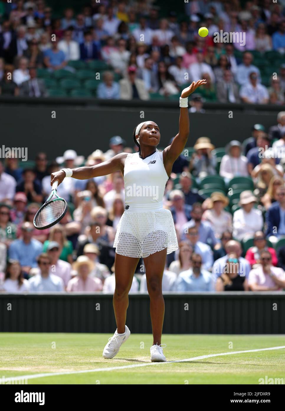 Coco Gauff serves against Amanda Anisimova during day six of the 2022