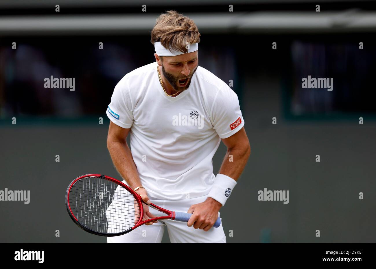 Liam Broady reacts during his Gentlemen's Singles third round match against Alex de Minaur during day six of the 2022 Wimbledon Championships at the All England Lawn Tennis and Croquet Club, Wimbledon. Picture date: Saturday July 2, 2022. Stock Photo