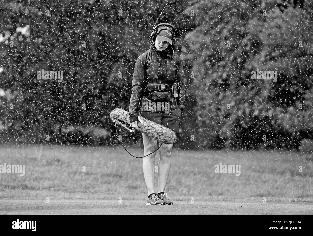 An oncourse sound recordist braves the elements during day two of the