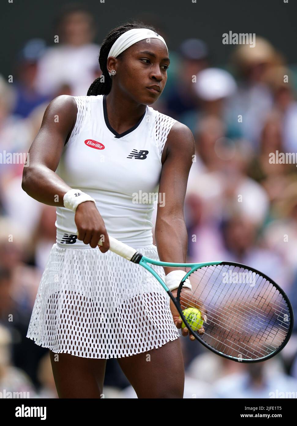 Coco Gauff serving against Amanda Anisimova during day six of the 2022