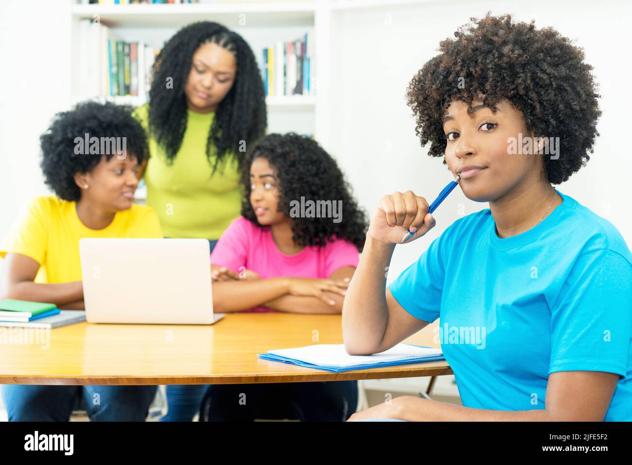 Group of young african american computer science students learning software development and programming at university Stock Photo