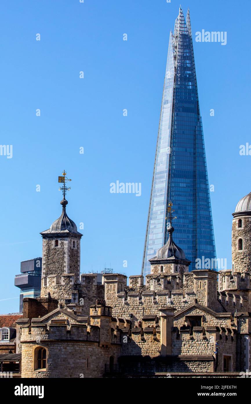London, UK - March 17th 2022: View of the Shard with the Tower of London in the foreground, in London, UK. Stock Photo