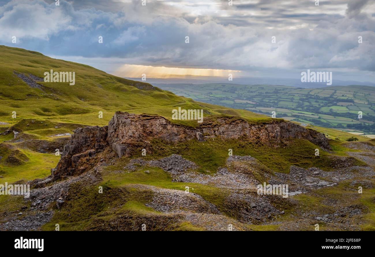 Sunset at the remains of a limestone quarry at Herbert's Quarry on the Black Mountain road in South Wales UK Stock Photo