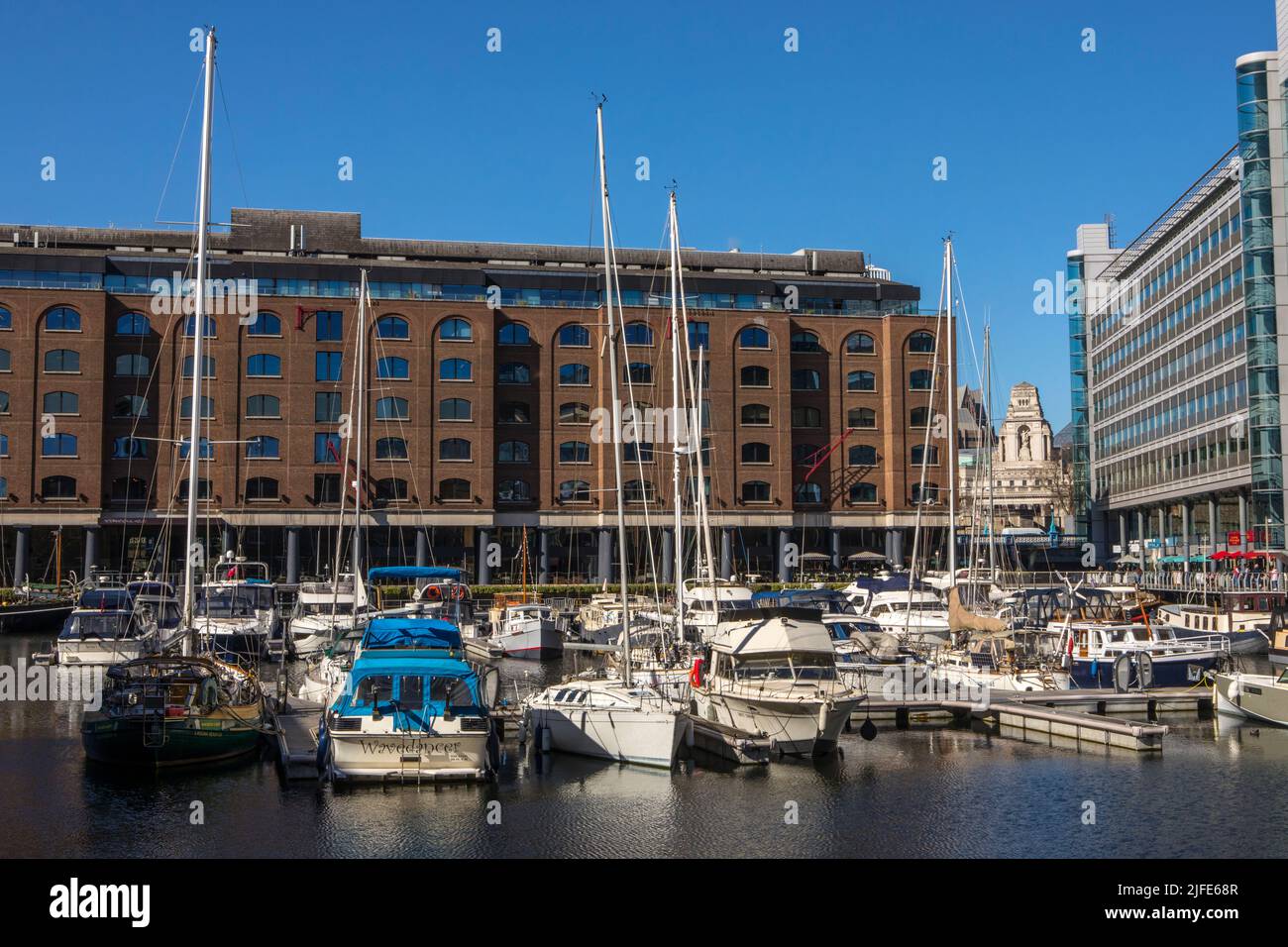 London, UK - March 18th 2022: View of the historic St. Katherines Dock in London, UK.  The 10 Trinity Square building, also known as the former Port o Stock Photo