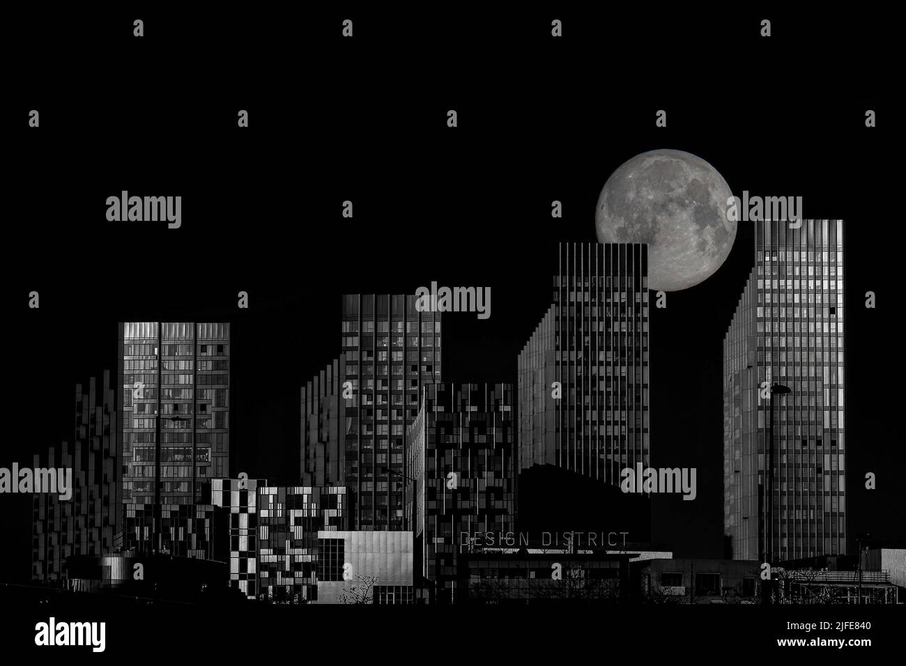 Design District near the O2 in London with a rising full moon behind