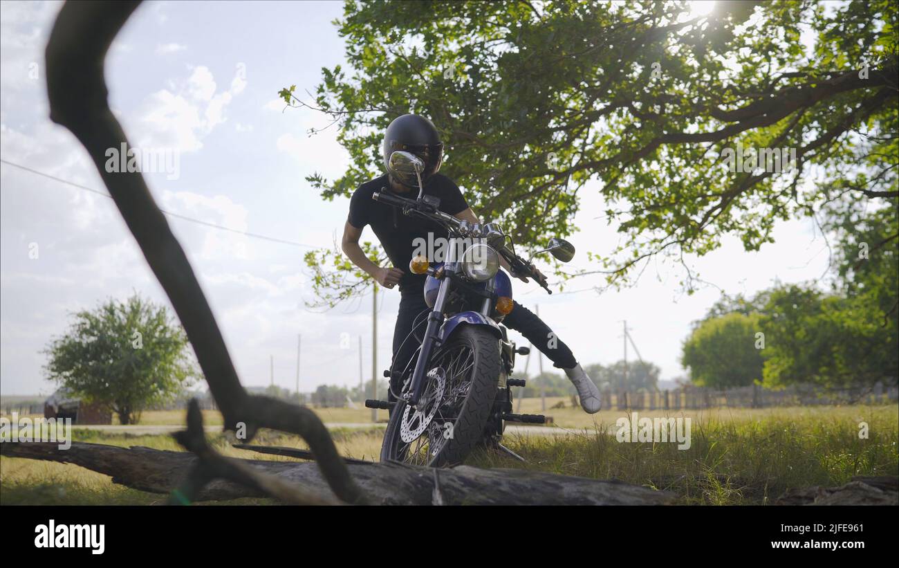 Man with helmet riding custom motorbike stock photo (193380) -  YouWorkForThem