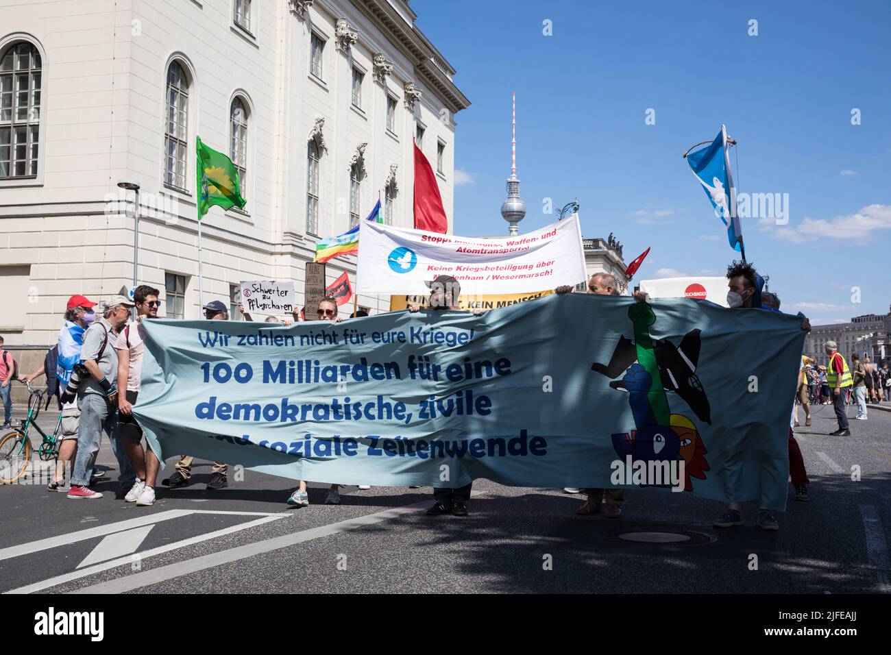 Berlin, Germany. 02nd July, 2022. July 2, 2022, Berlin, Germany: The anti-war protest started at Bebelplatz in Berlin on July 2, 2022. The name of the rally was ''die Zeitwende, in English, ''the turning point''. Under the slogan ''we won't pay for your wars'', people described their views against NATO. Protesters said in several speeches that the rearmament policy is fundamentally wrong, hazardous, and cynical because it means responding to the social crisis with militarism instead of social progress. Protesters were also against the rearmament of the German army and for a new peace movement. Stock Photo