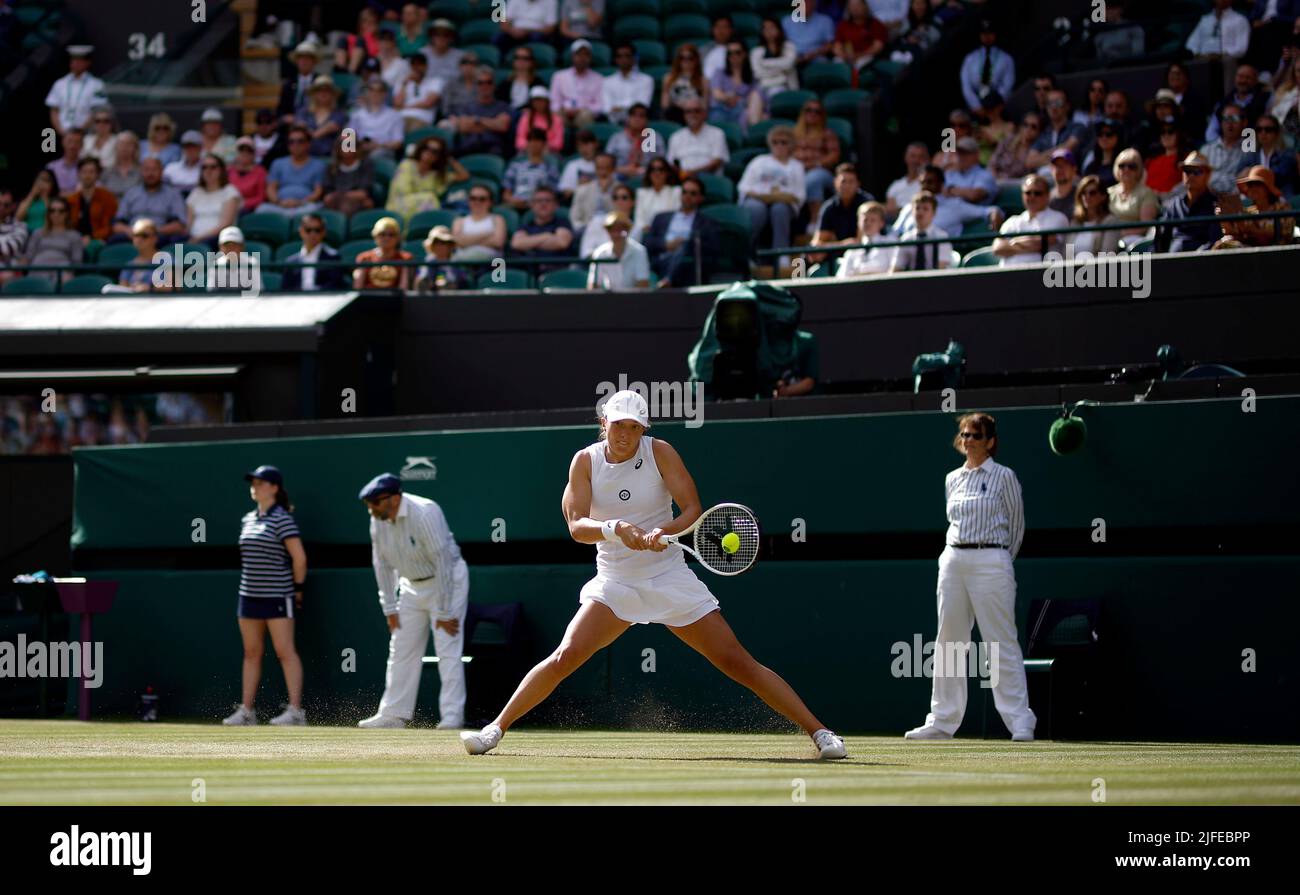 Iga Swiatek in action during her Ladies’ Singles third round match against Alize Cornet during day six of the 2022 Wimbledon Championships at the All England Lawn Tennis and Croquet Club, Wimbledon. Picture date: Saturday July 2, 2022. Stock Photo