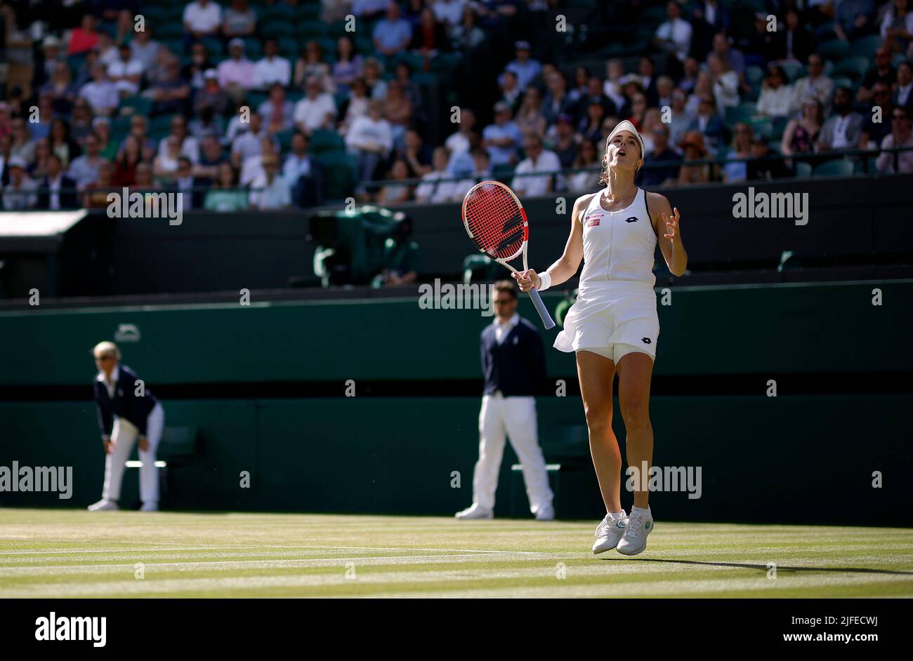 Alize Cornet reacts during her Ladies’ Singles third round match against Iga Swiatek during day six of the 2022 Wimbledon Championships at the All England Lawn Tennis and Croquet Club, Wimbledon. Picture date: Saturday July 2, 2022. Stock Photo