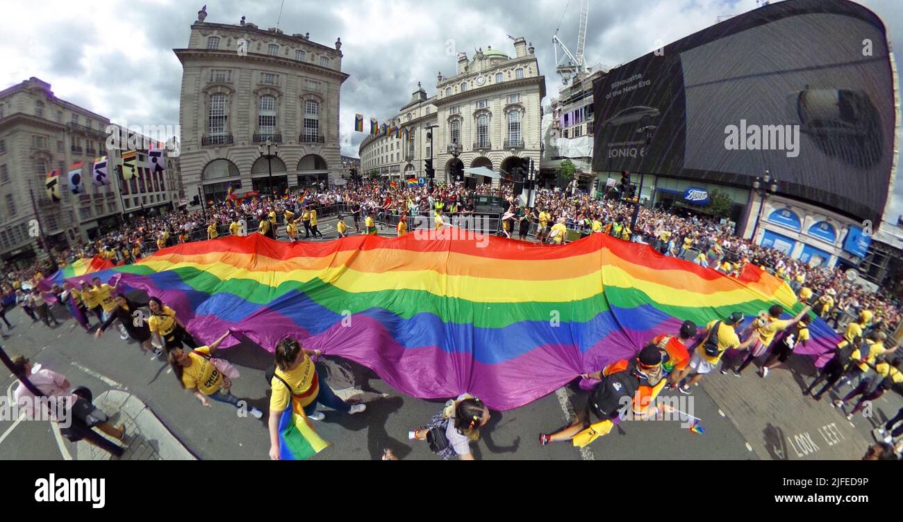 London, UK. 2nd July, 2022. Giant rainbow flag passing Piccadilly Circus at the Pride in London Parade. More than 30,000 participants took part in the Pride Parade in London, celebrating 50 years of Pride and LGBT  protest. Credit: Paul Brown/Alamy Live News Stock Photo