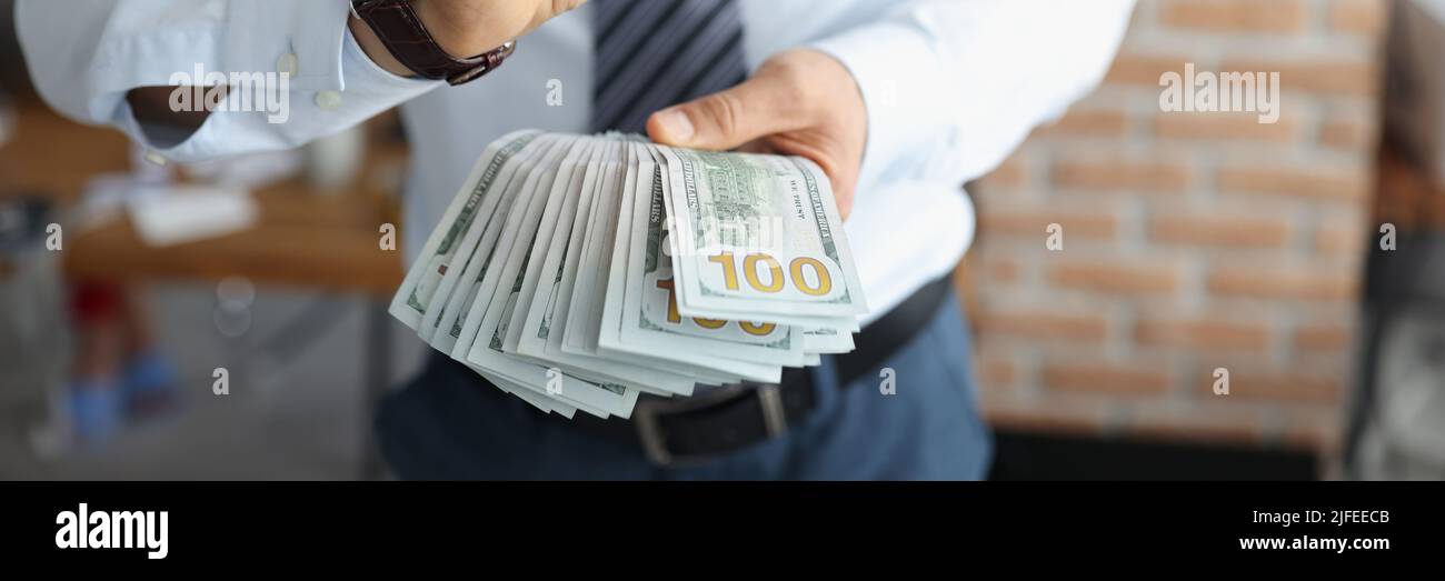 Man in suit with cash Stock Photo