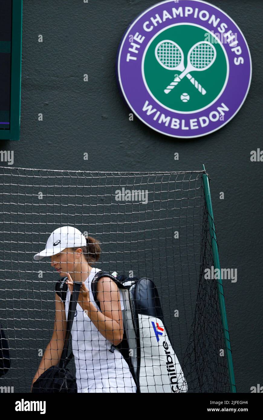 Iga Swiatek leaves the court after her Ladies' Singles third round defeat against Alize Cornet during day six of the 2022 Wimbledon Championships at the All England Lawn Tennis and Croquet Club, Wimbledon. Picture date: Saturday July 2, 2022. Stock Photo