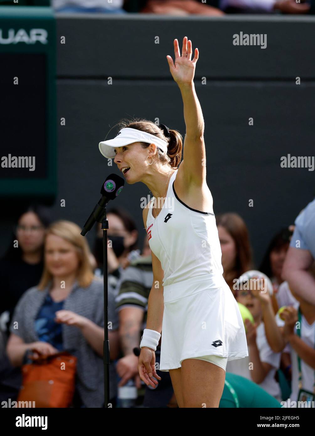 Alize Cornet waves to the crowd after winning her Ladies' Singles third round match against Iga Swiatek during day six of the 2022 Wimbledon Championships at the All England Lawn Tennis and Croquet Club, Wimbledon. Picture date: Saturday July 2, 2022. Stock Photo