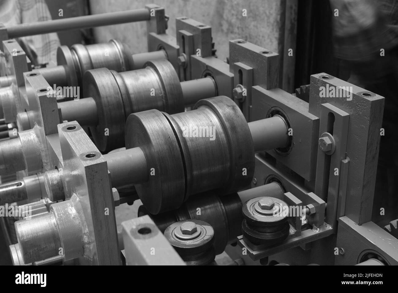 Closeup of a metal shaft parts of Lathe Machinery. Vintage Industrial Machinery in a old factory. Stock Photo
