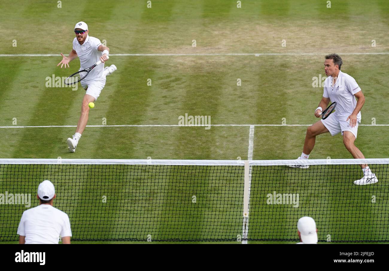 Jamie Murray (left) in action with Bruno Soares in their Gentlemen's Doubles match against Andrea Vavassori and Nikola Cacic during day six of the 2022 Wimbledon Championships at the All England Lawn Tennis and Croquet Club, Wimbledon. Picture date: Saturday July 2, 2022. Stock Photo