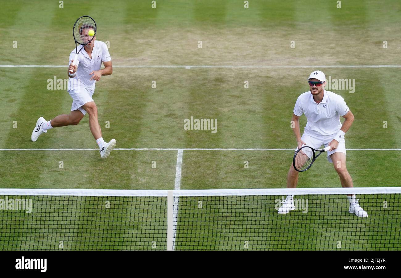 Jamie Murray (right) in action with Bruno Soares in their Gentlemen's Doubles match against Andrea Vavassori and Nikola Cacic during day six of the 2022 Wimbledon Championships at the All England Lawn Tennis and Croquet Club, Wimbledon. Picture date: Saturday July 2, 2022. Stock Photo