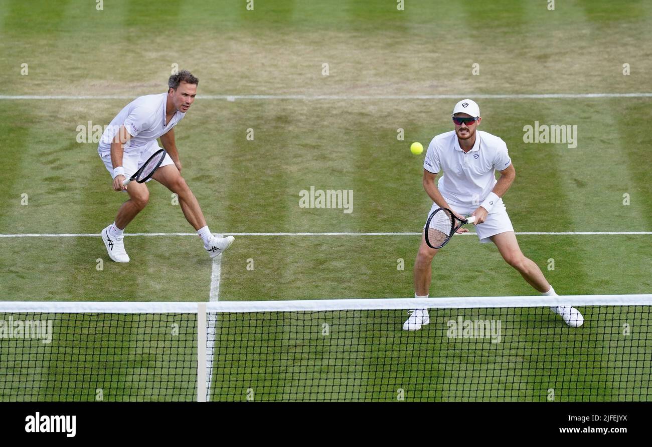Jamie Murray (right) in action with Bruno Soares in their Gentlemen's Doubles match against Andrea Vavassori and Nikola Cacic during day six of the 2022 Wimbledon Championships at the All England Lawn Tennis and Croquet Club, Wimbledon. Picture date: Saturday July 2, 2022. Stock Photo