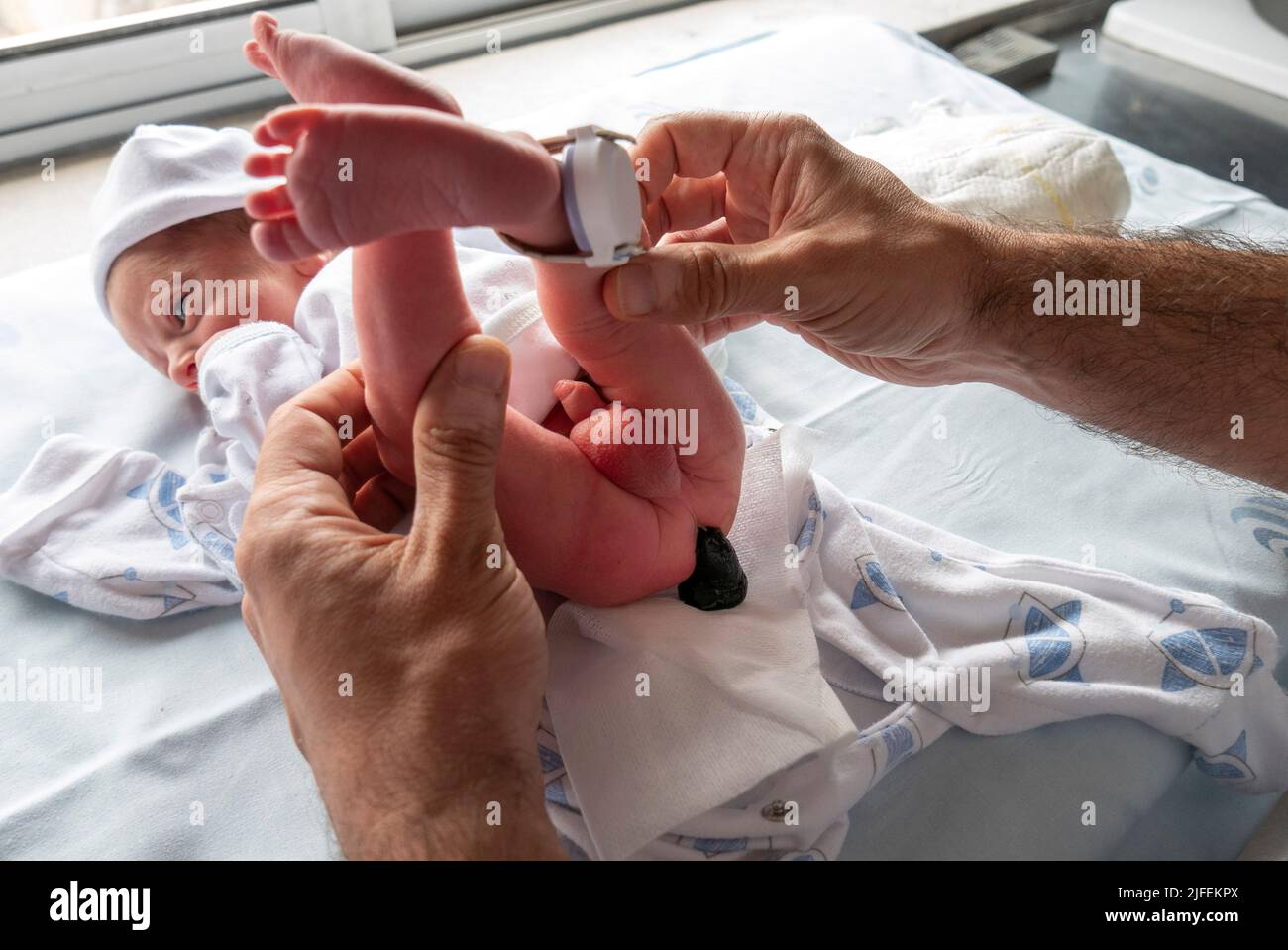 Newborn baby pooping meconium Stock Photo