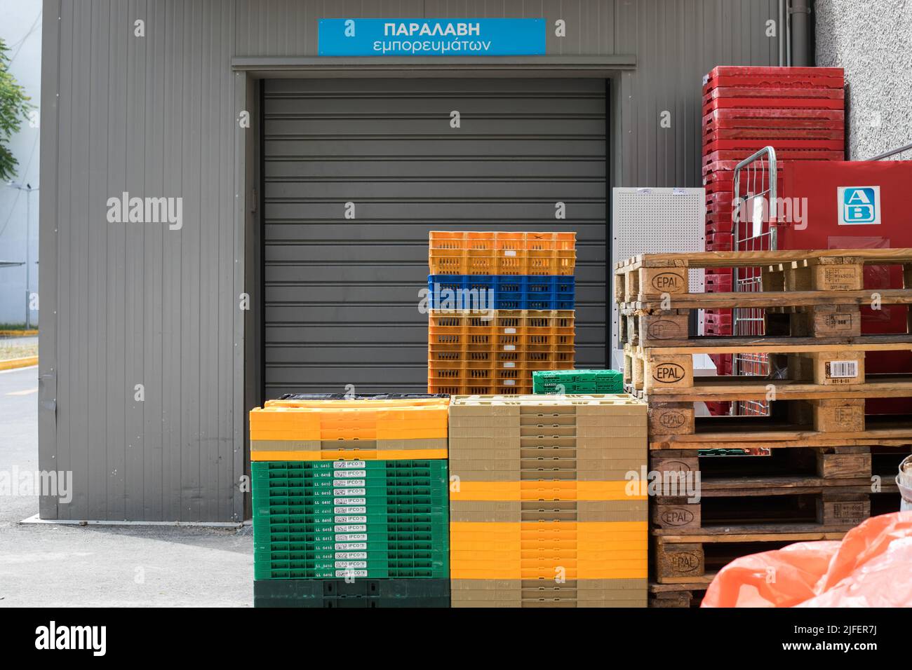 A stack of black empty plastic boxes for storing and transporting