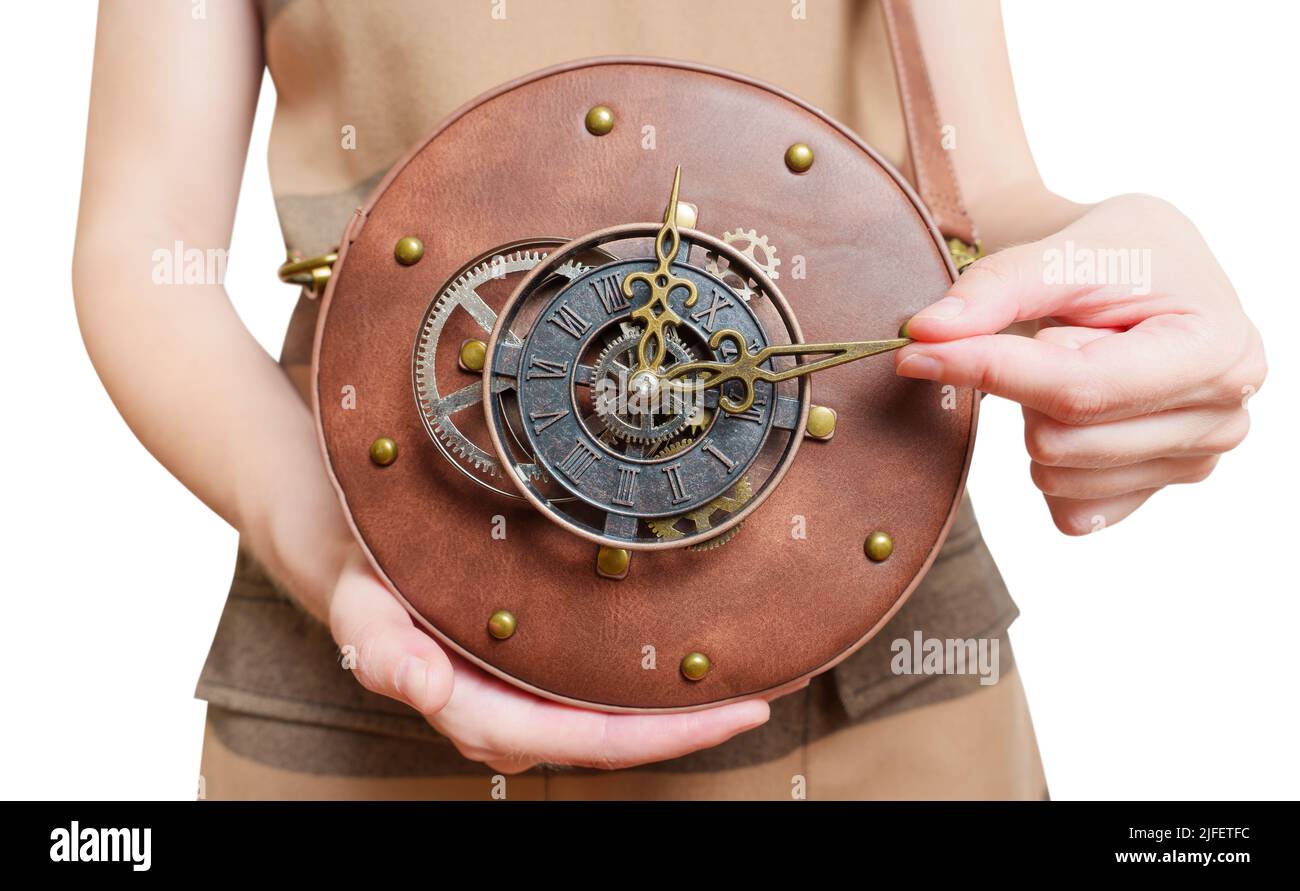 Female holding a circle steampunk leather bag with a clockwork isolated on white. Stock Photo