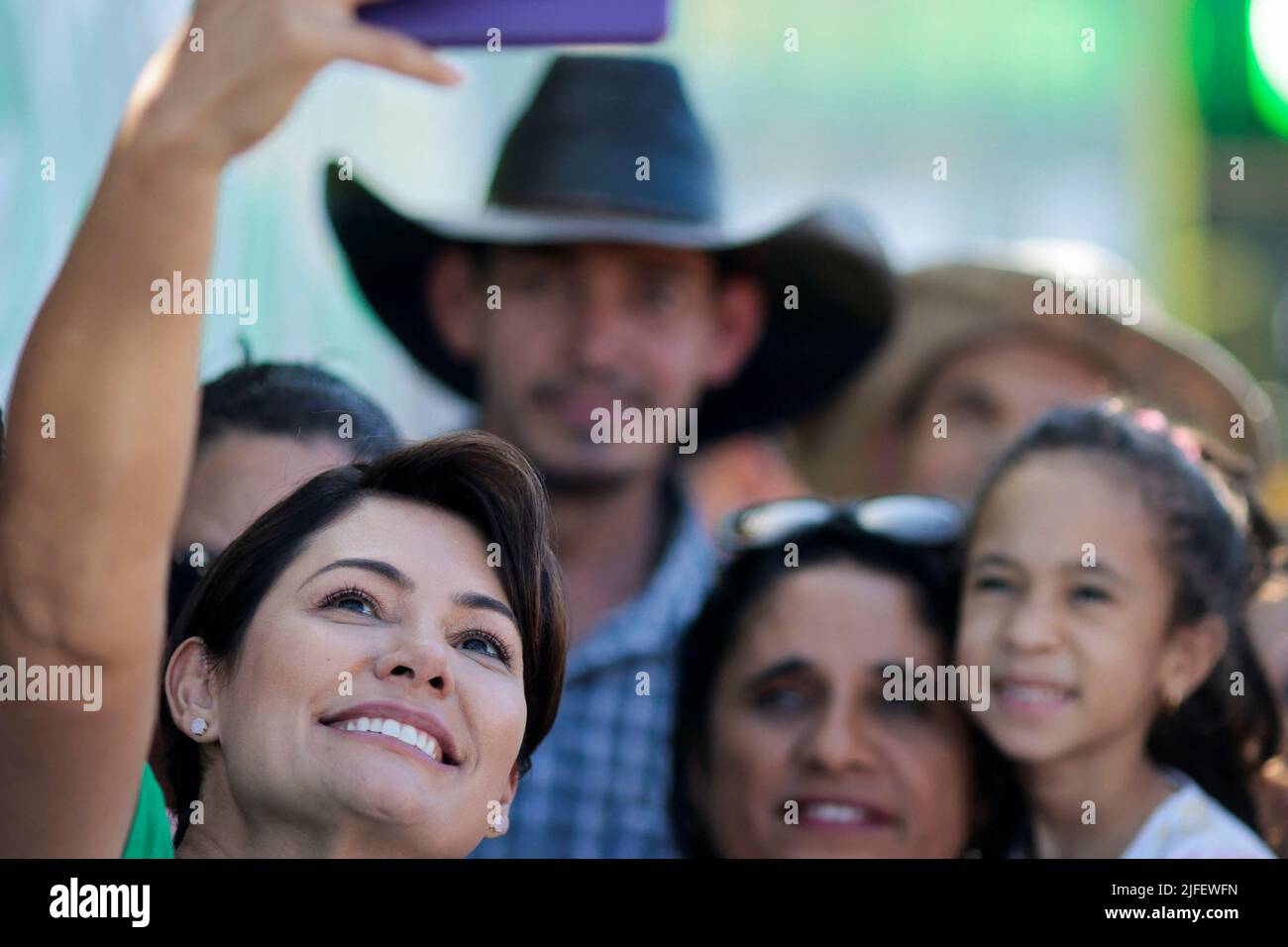 Brazilian First Lady Michelle Bolsonaro takes a photo with people during an Evangelical March for Jesus in Brasilia, Brazil July 2, 2022. REUTERS/Ueslei Marcelino Stock Photo