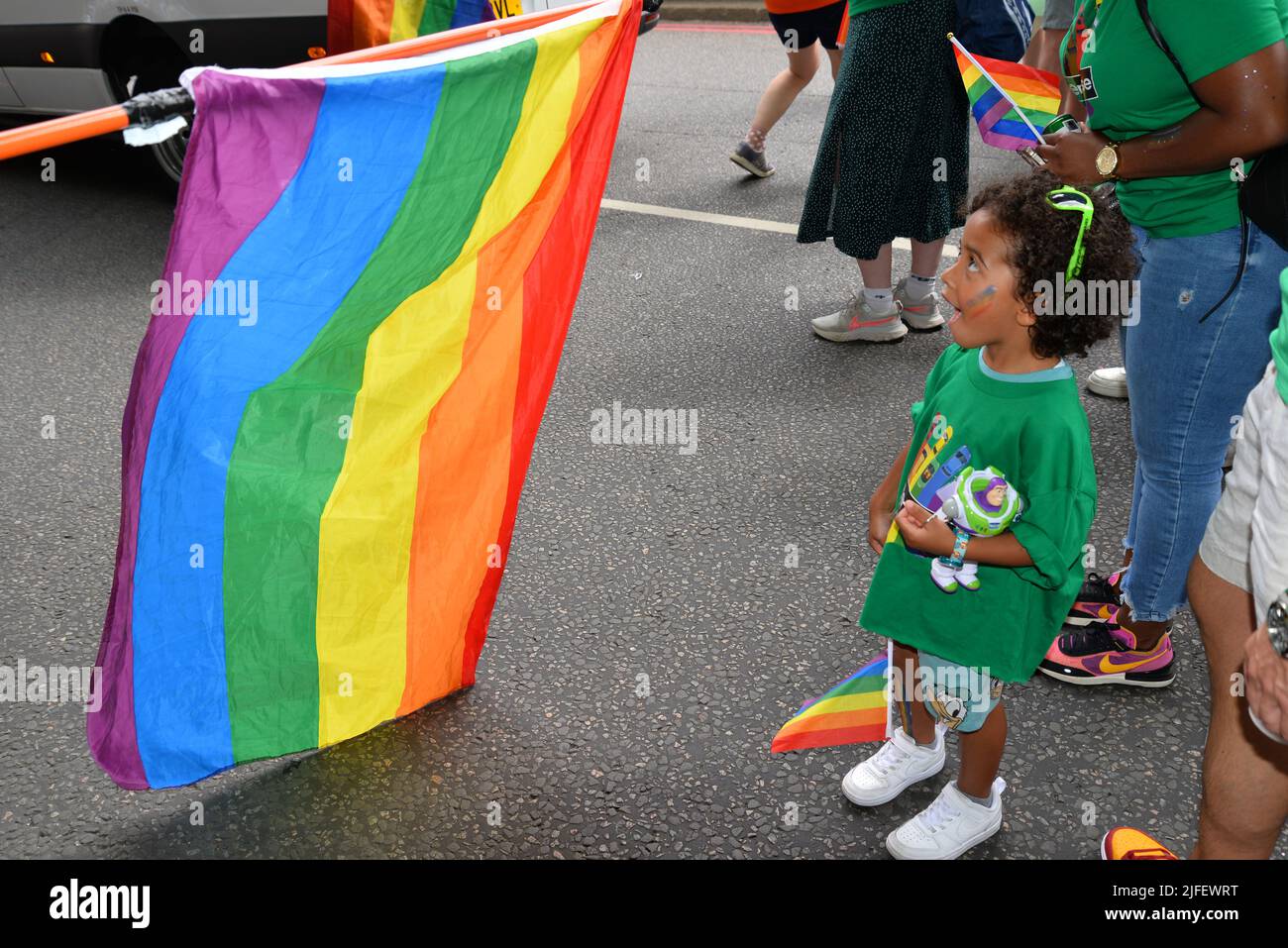 Young child, child, Rainbow Flag, Pride, Pride 50, Celebrations, LGBT, LGBTQ, Youngster, Parade, Green, Amazement, Colourful Stock Photo