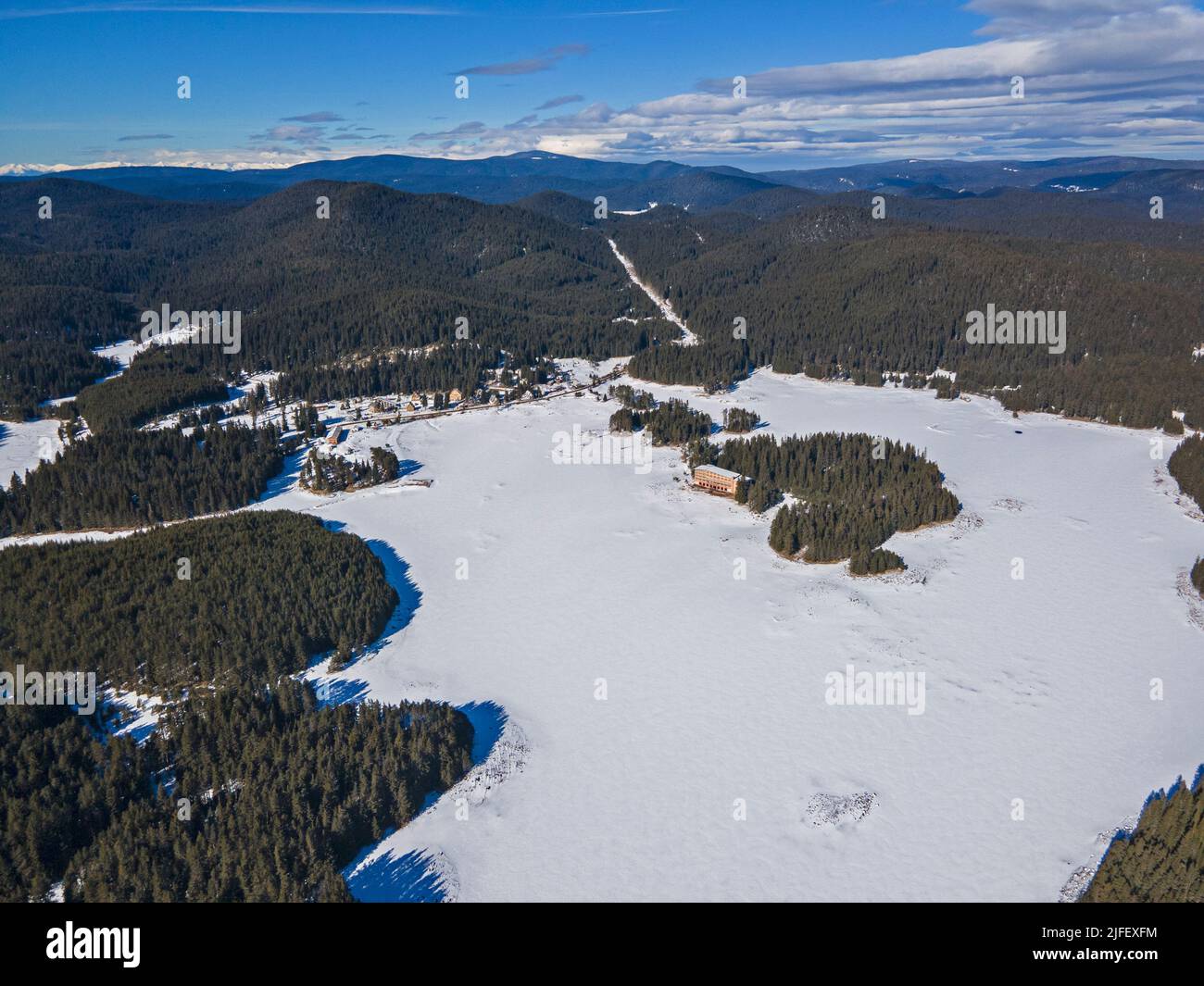 aerial-winter-view-of-shiroka-polyana-wide-meadow-reservoir-covered