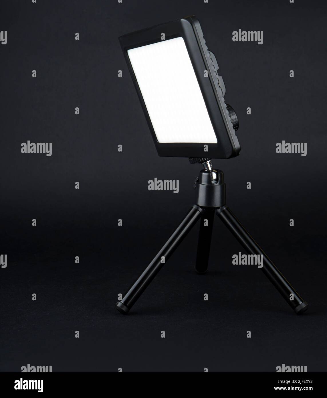flashlight searchlight for video filming on a black background Stock Photo