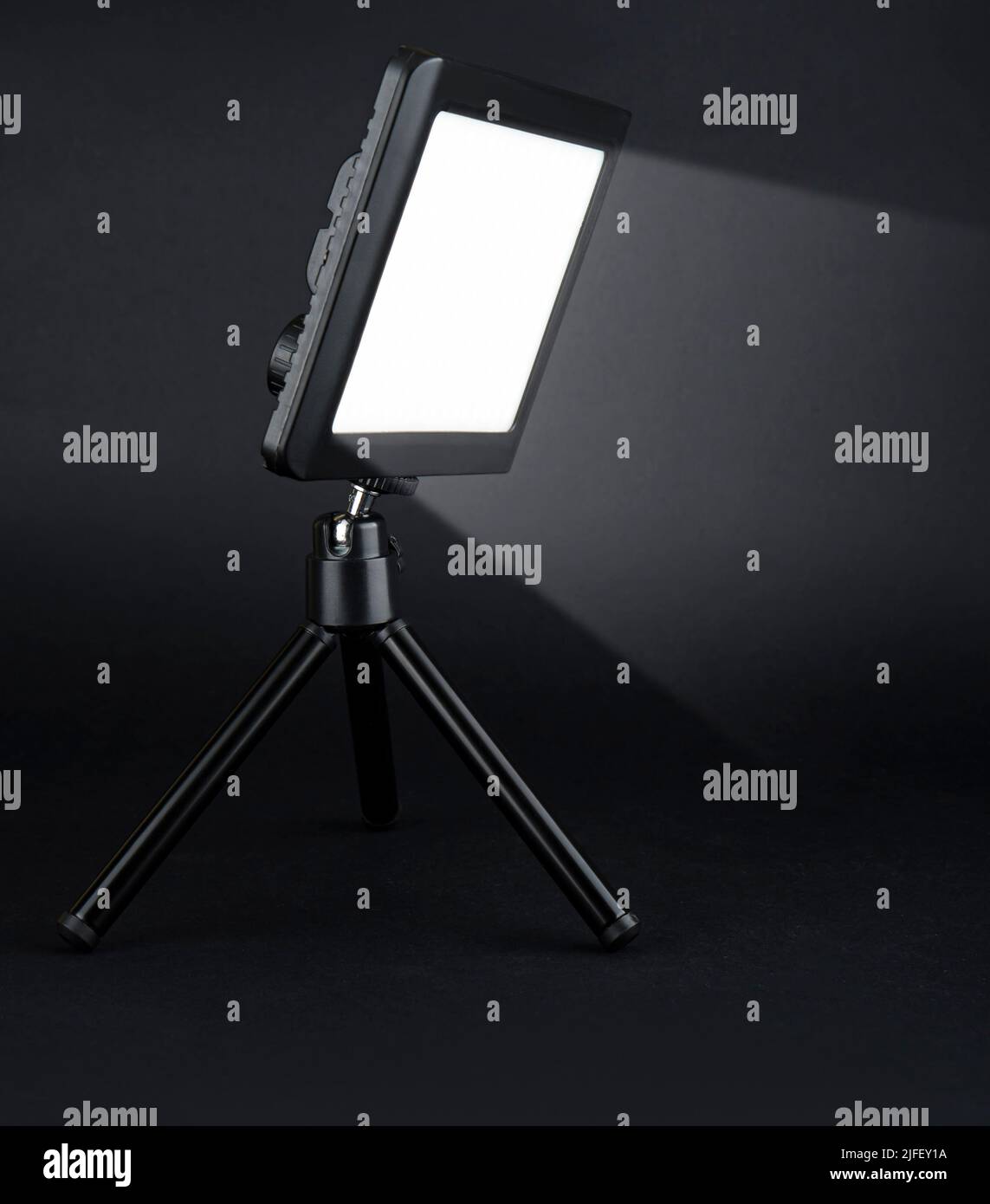 flashlight searchlight for video filming on a black background Stock Photo