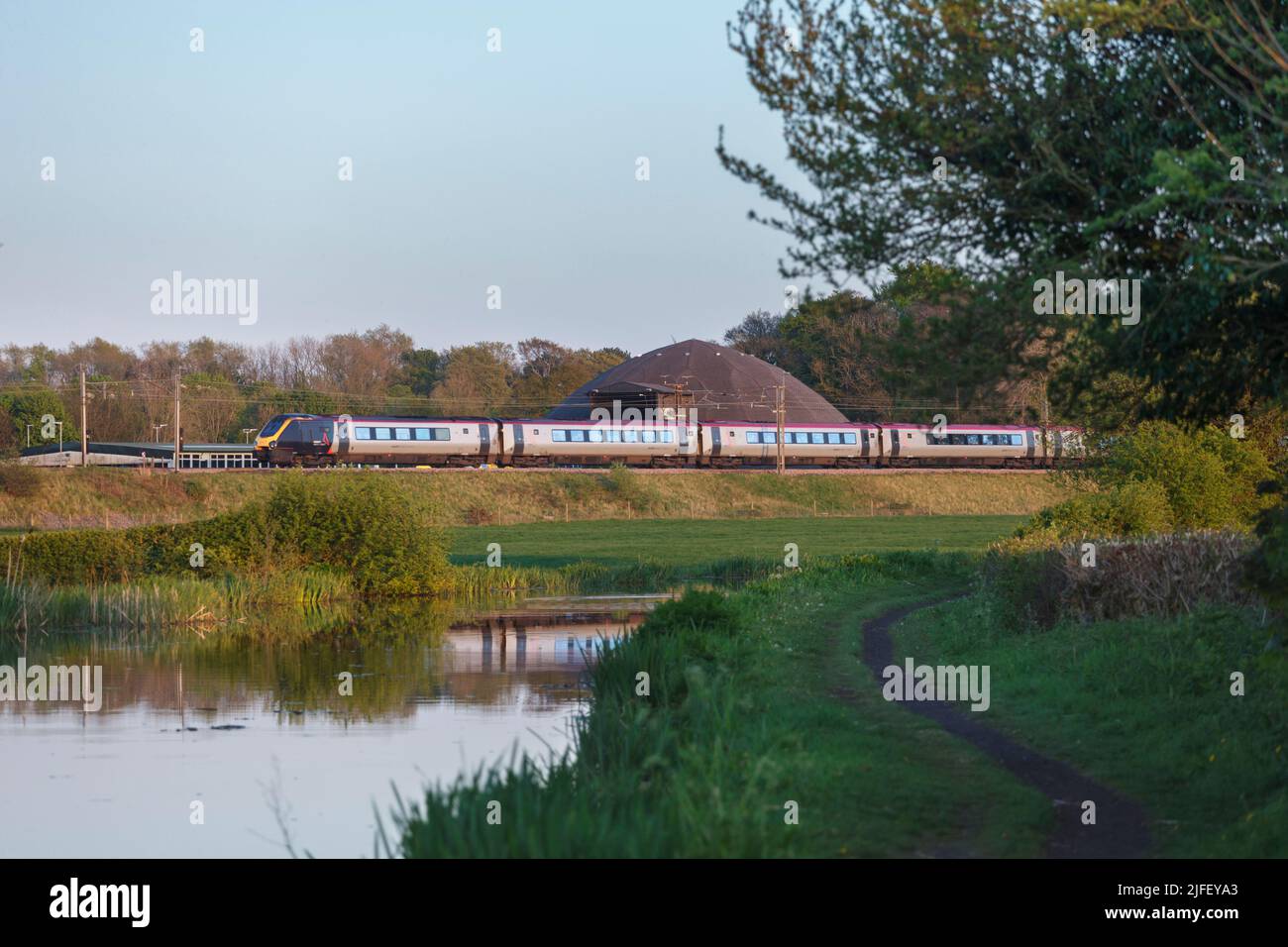 Avanti west coast class 221 Bombardier voyager train  passing Catterall and the Lancaster canal on the west coast mainline in Lancashire Stock Photo