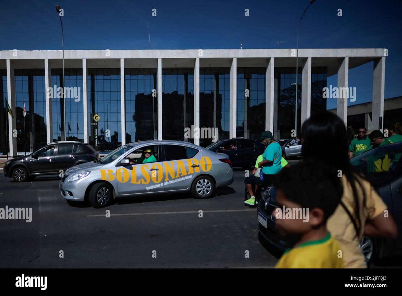A man drives his car with a sticker reading the name of Brazilian President Jair Bolsonaro, during an Evangelical March for Jesus in Brasilia, Brazil July 2, 2022. REUTERS/Ueslei Marcelino Stock Photo