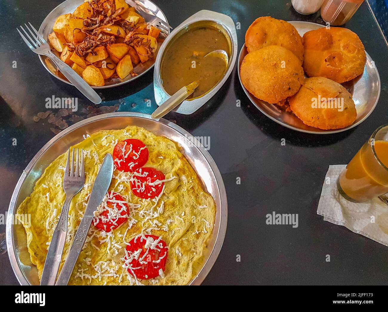 Typical indian food with fried potatoes aloo puri curry in Agra Uttar Pradesh India Stock Photo