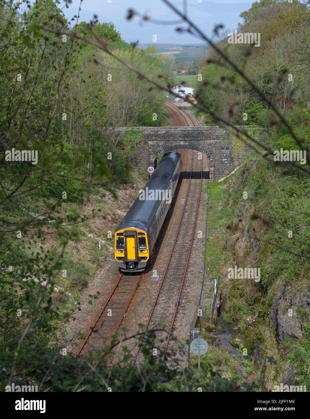 Northern Rail class 158 train leaving Melling tunnel on the rural