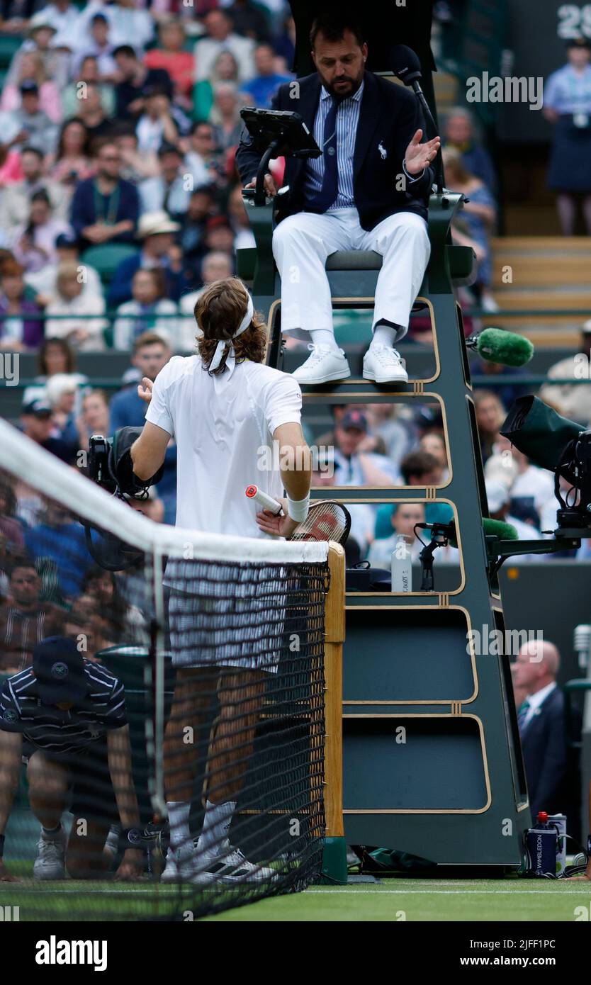 Stefanos Tsitsipas speaks to the umpire after losing the third set during his Men's Singles third round match against Nick Kyrgios during day six of the 2022 Wimbledon Championships at the All England Lawn Tennis and Croquet Club, Wimbledon. Picture date: Saturday July 2, 2022. Stock Photo