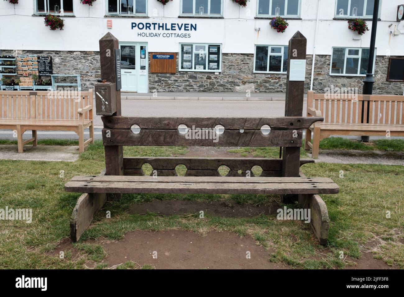 Wooden Stocks in Porthleven, Cornwall Stock Photo