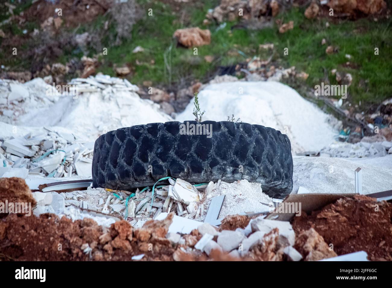 Truck tire and garbage thrown by the roadside Stock Photo Alamy