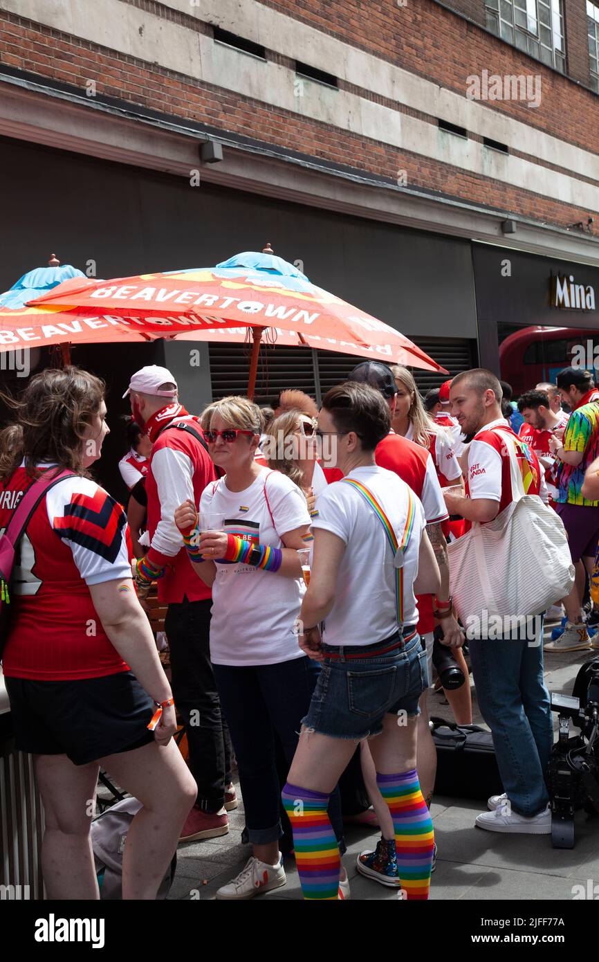 Gay Pride March - Marchers waiting outside City of Quebec Pub  -  2 July 2022,  London, UK Stock Photo
