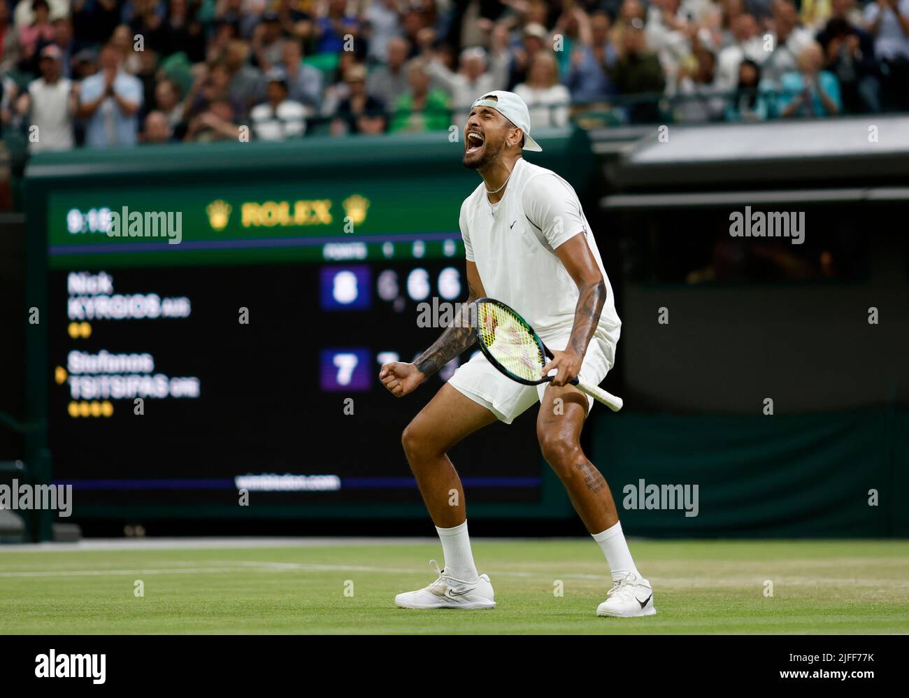 Nick Kyrgios reacts after winning his Men's Singles third round match against Stefanos Tsitsipas during day six of the 2022 Wimbledon Championships at the All England Lawn Tennis and Croquet Club, Wimbledon. Picture date: Saturday July 2, 2022. Stock Photo