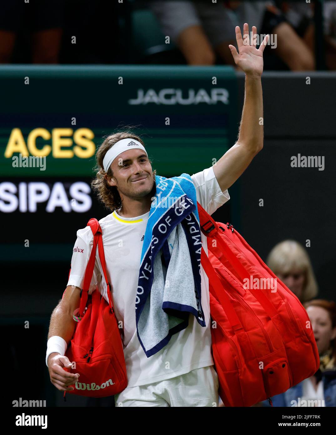 Stefanos Tsitsipas waves to the crowd after losing his Men's Singles third round match against Nick Kyrgios during day six of the 2022 Wimbledon Championships at the All England Lawn Tennis and Croquet Club, Wimbledon. Picture date: Saturday July 2, 2022. Stock Photo